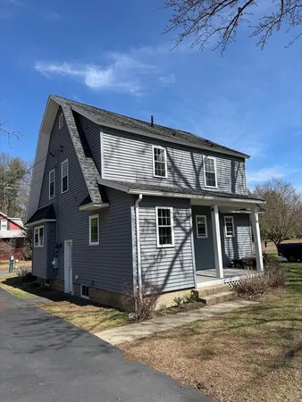 a front view of a house with a ocean view
