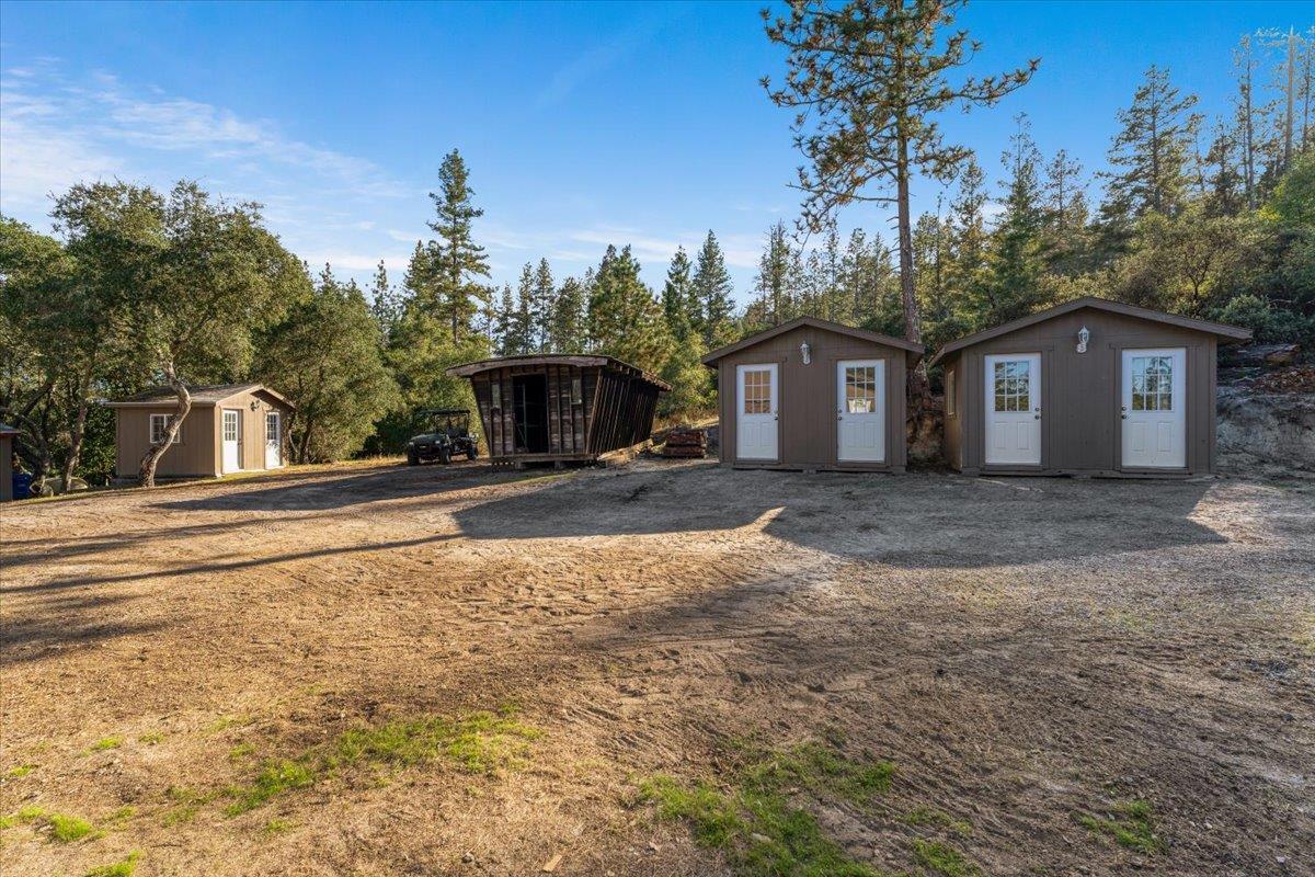 7409 Hihn Road Ben Lomond, CA 95005 - Photo 93 of 101 a front view of a house with a yard and trees
