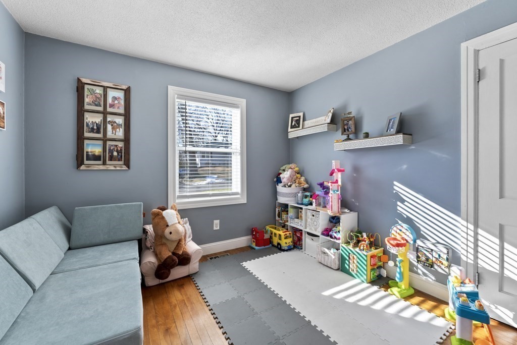 26 Exeter Street West Springfield, MA 01089 - Photo 14 of 42 a bed room with furniture and a couch
