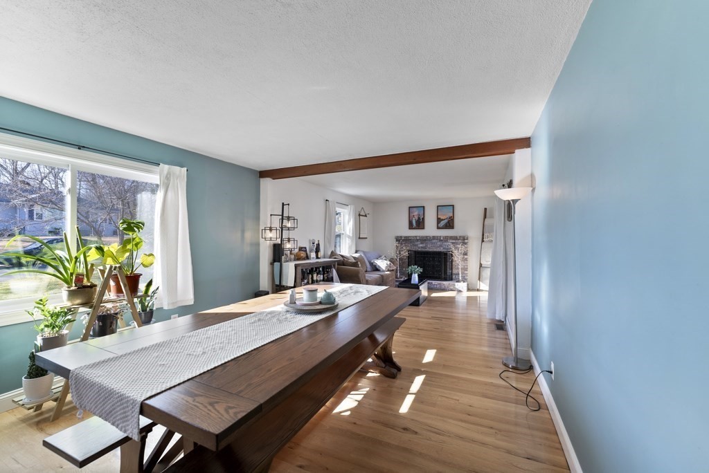 26 Exeter Street West Springfield, MA 01089 - Photo 21 of 42 a dining room with furniture a fireplace and wooden floor