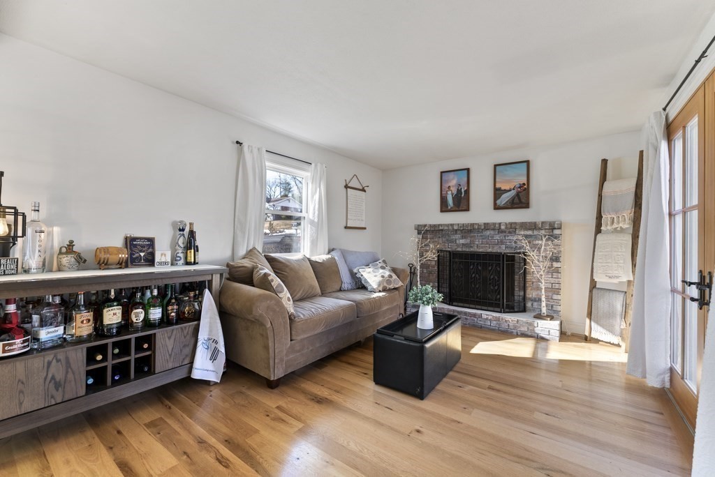 26 Exeter Street West Springfield, MA 01089 - Photo 25 of 42 a living room with furniture and a fireplace
