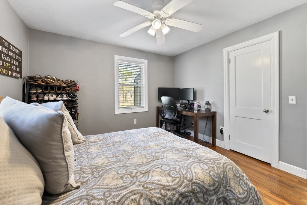 26 Exeter Street West Springfield, MA 01089 - Photo 28 of 42 a bedroom with a bed and wooden floor