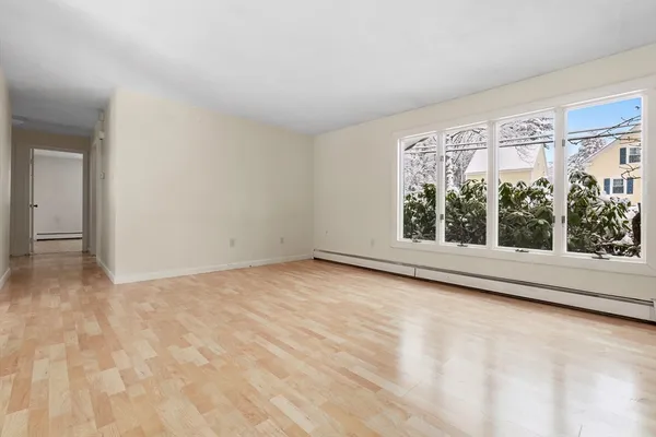 a view of an empty room with a window