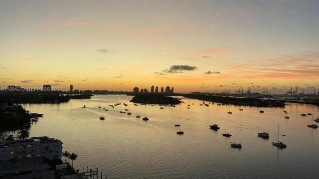 a very nice looking room with a large window and furniture