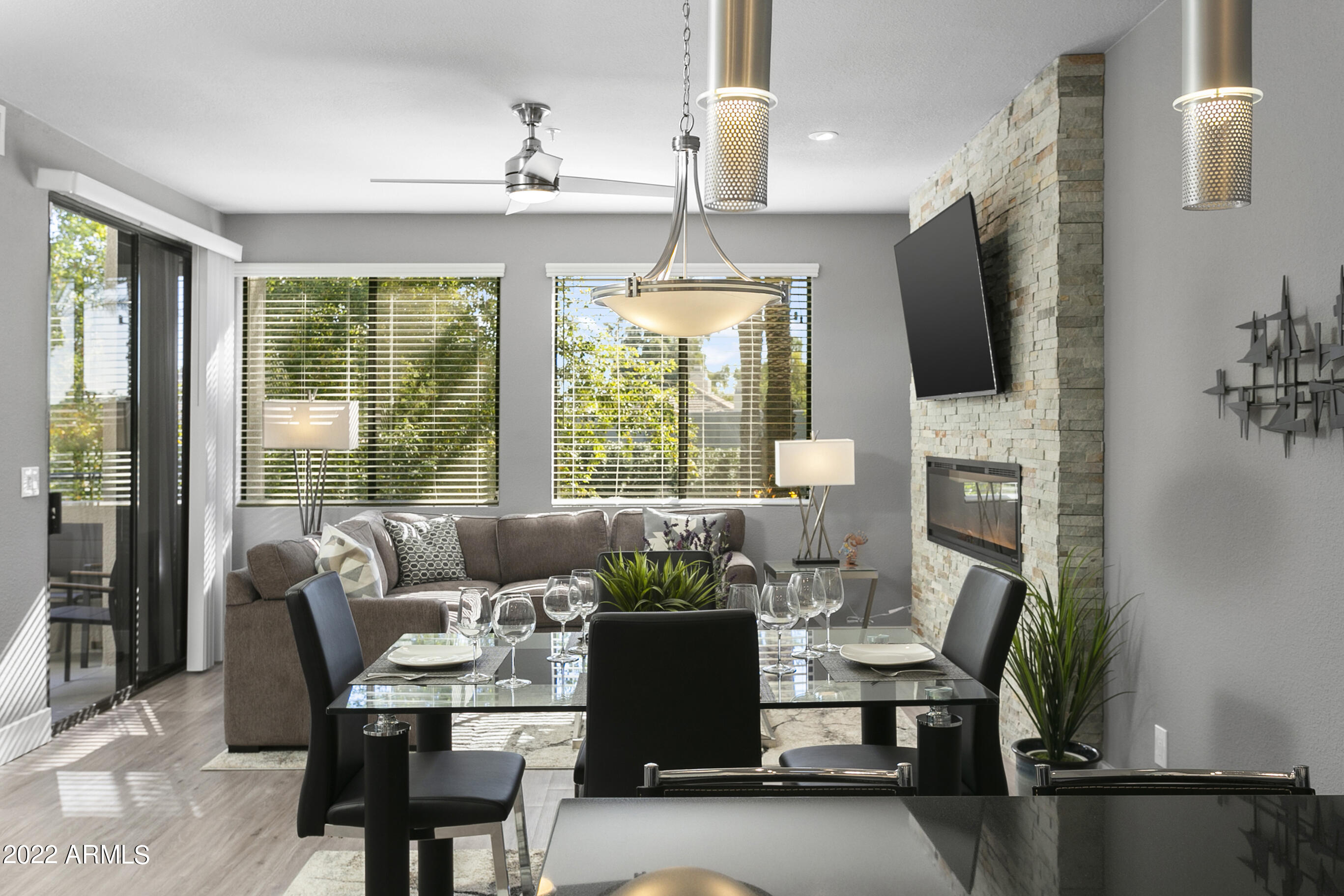 7700 East Gainey Ranch Road, Unit 206 Scottsdale, AZ 85258 - Photo 11 of 33 a living room with furniture fireplace and flat screen tv