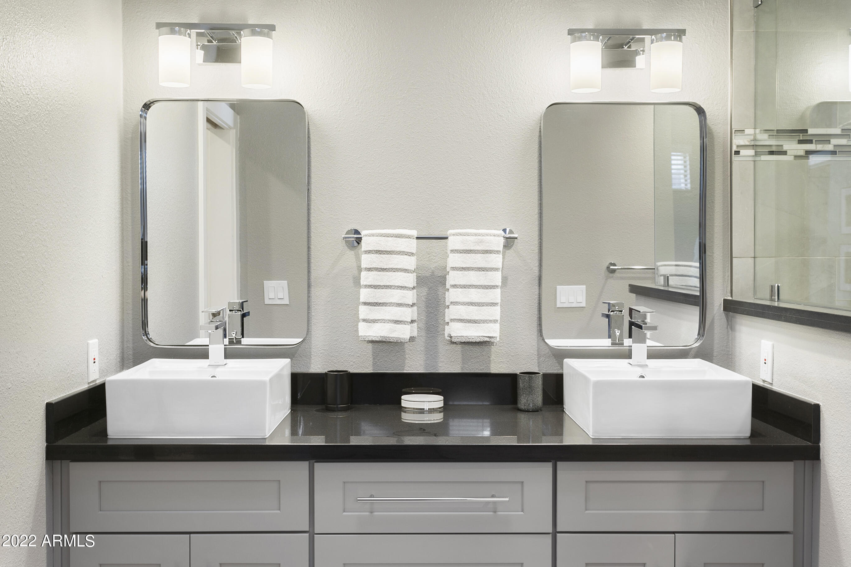 7700 East Gainey Ranch Road, Unit 206 Scottsdale, AZ 85258 - Photo 18 of 33 a bathroom with a sink and a mirror