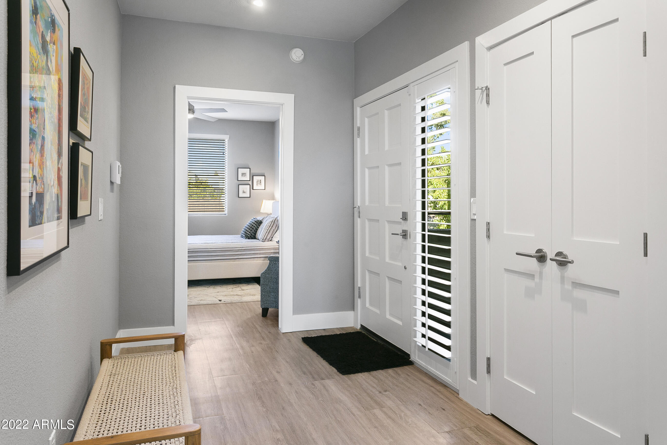 7700 East Gainey Ranch Road, Unit 206 Scottsdale, AZ 85258 - Photo 21 of 33 a bedroom with furniture and a window