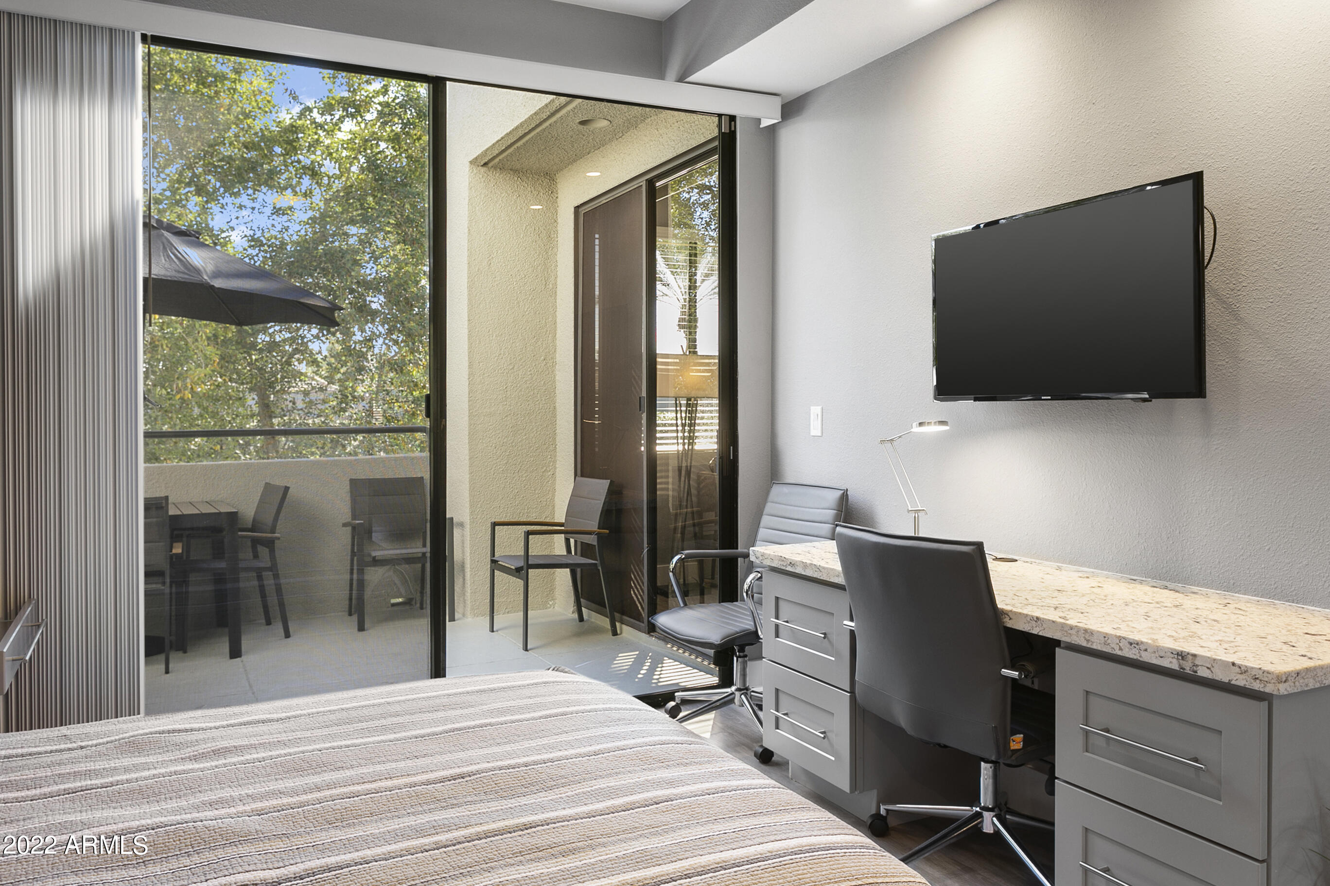 7700 East Gainey Ranch Road, Unit 206 Scottsdale, AZ 85258 - Photo 24 of 33 a view of a workspace with furniture and a window