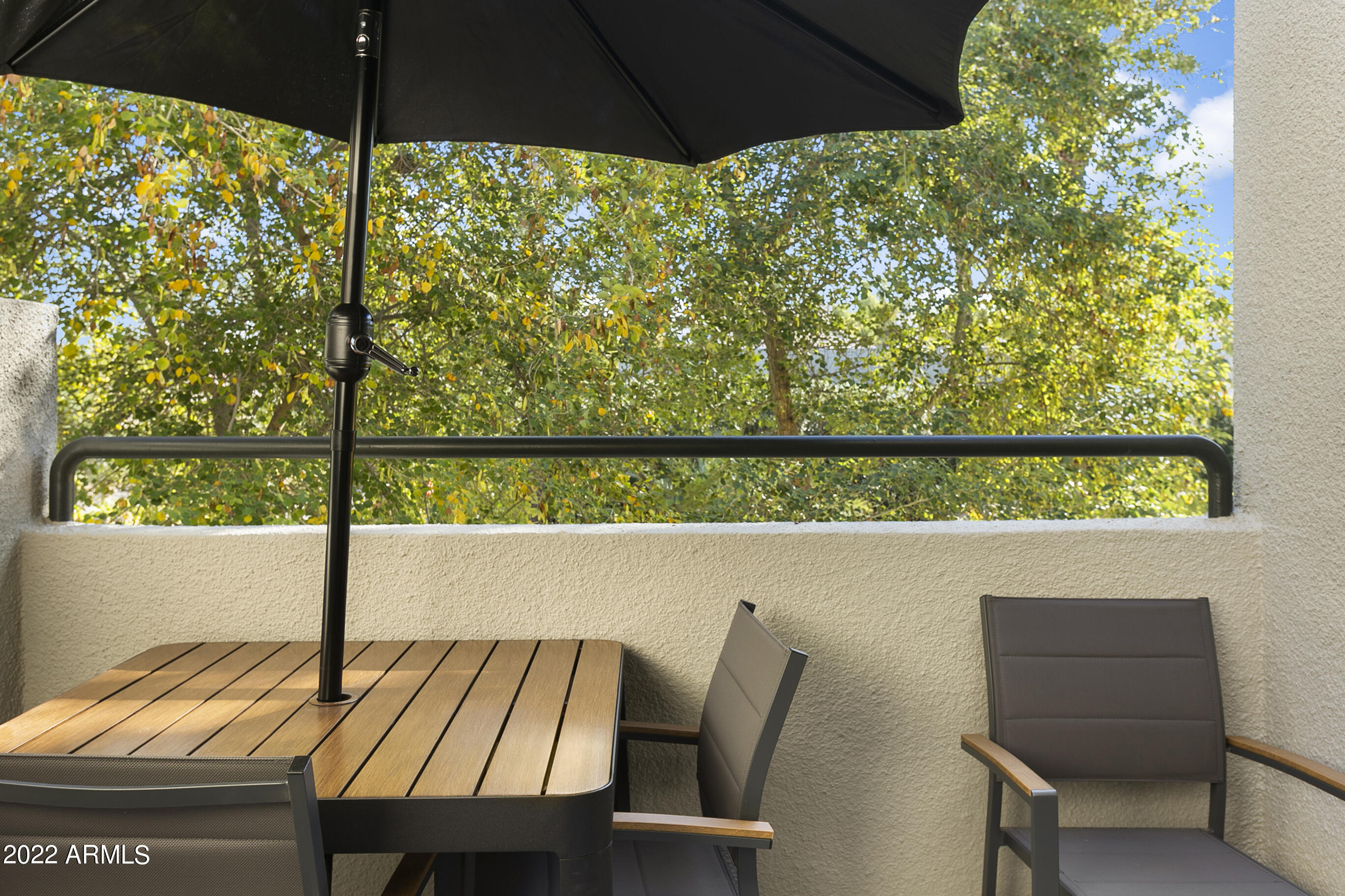 7700 East Gainey Ranch Road, Unit 206 Scottsdale, AZ 85258 - Photo 28 of 33 a view of table and chair with wooden floor