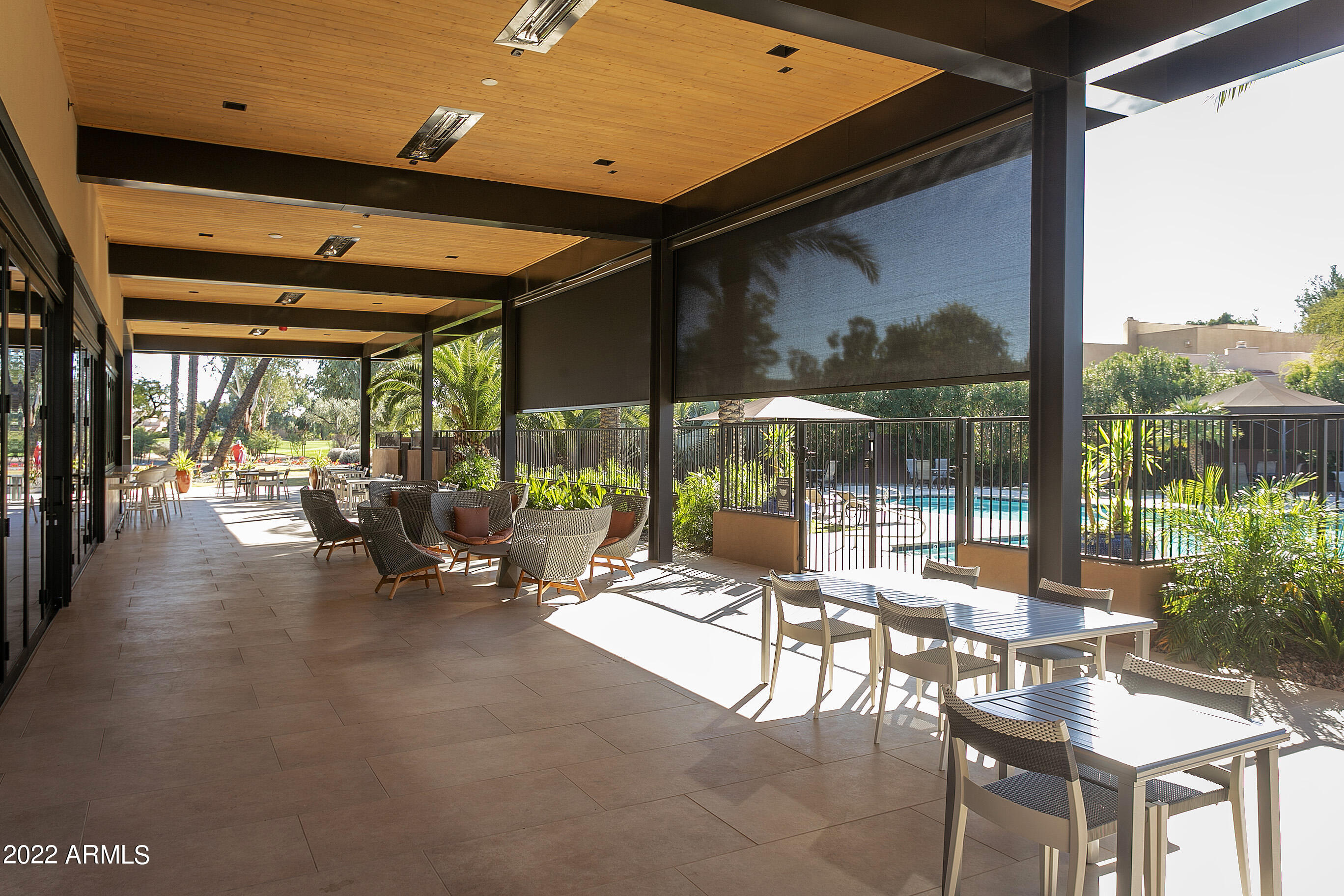 7700 East Gainey Ranch Road, Unit 206 Scottsdale, AZ 85258 - Photo 32 of 33 a building outdoor space with patio furniture and potted plants