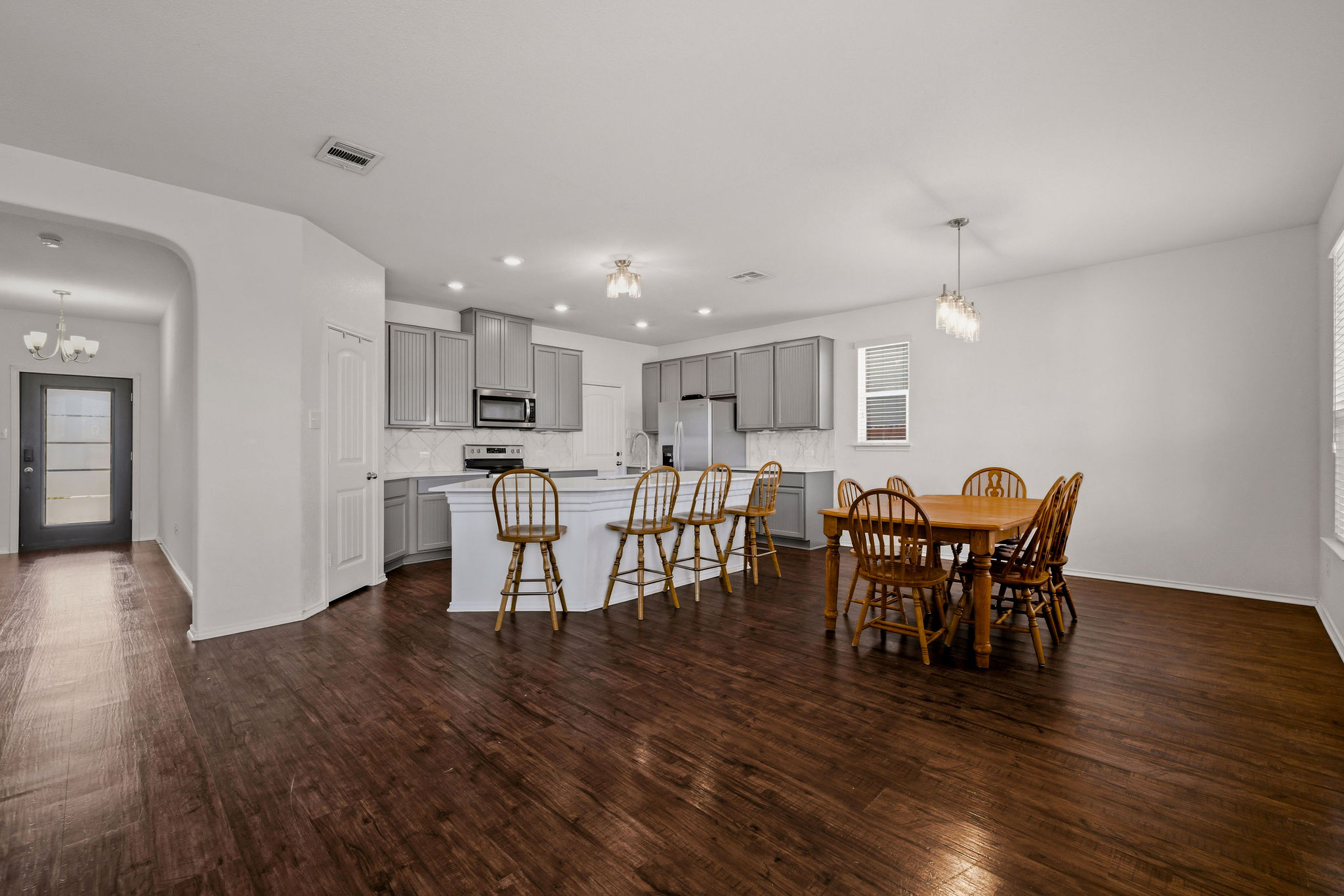220 Saranac Drive Elgin, TX 78621 - Photo 11 of 32 a view of a dining room with furniture and wooden floor