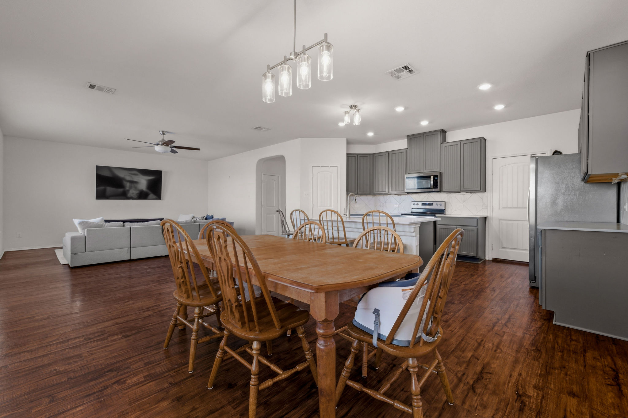 220 Saranac Drive Elgin, TX 78621 - Photo 15 of 32 a view of a dining room with furniture and wooden floor