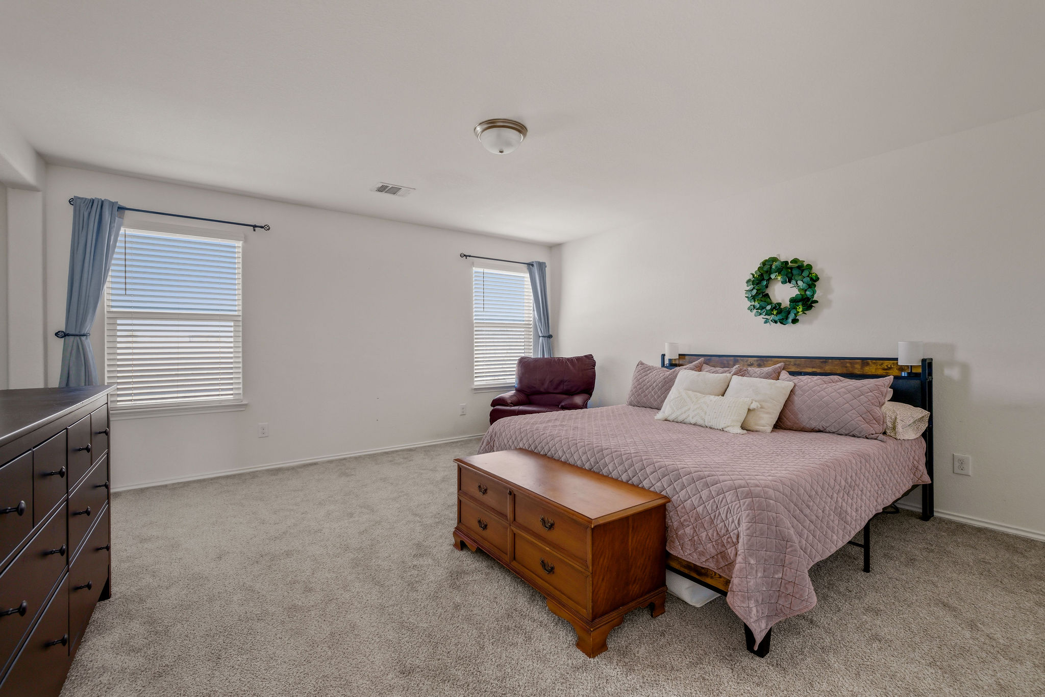 220 Saranac Drive Elgin, TX 78621 - Photo 17 of 32 a bedroom with a bed and a window