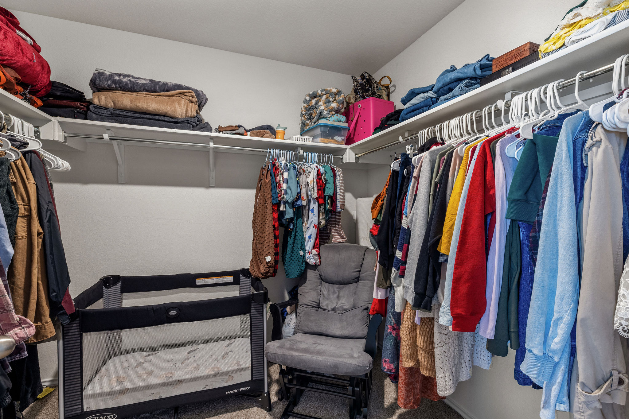 220 Saranac Drive Elgin, TX 78621 - Photo 23 of 32 a view of walk in closet with clothes