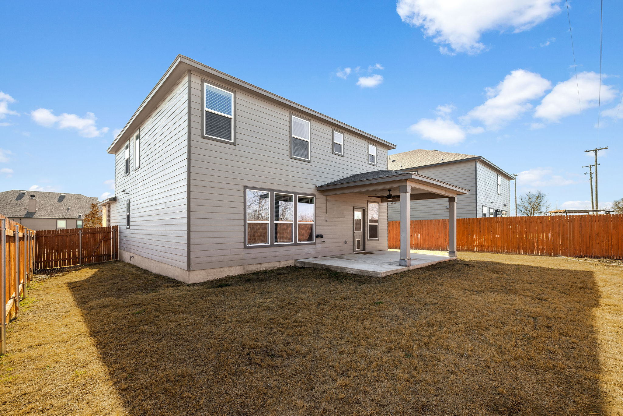 220 Saranac Drive Elgin, TX 78621 - Photo 31 of 32 a front view of a house with a yard