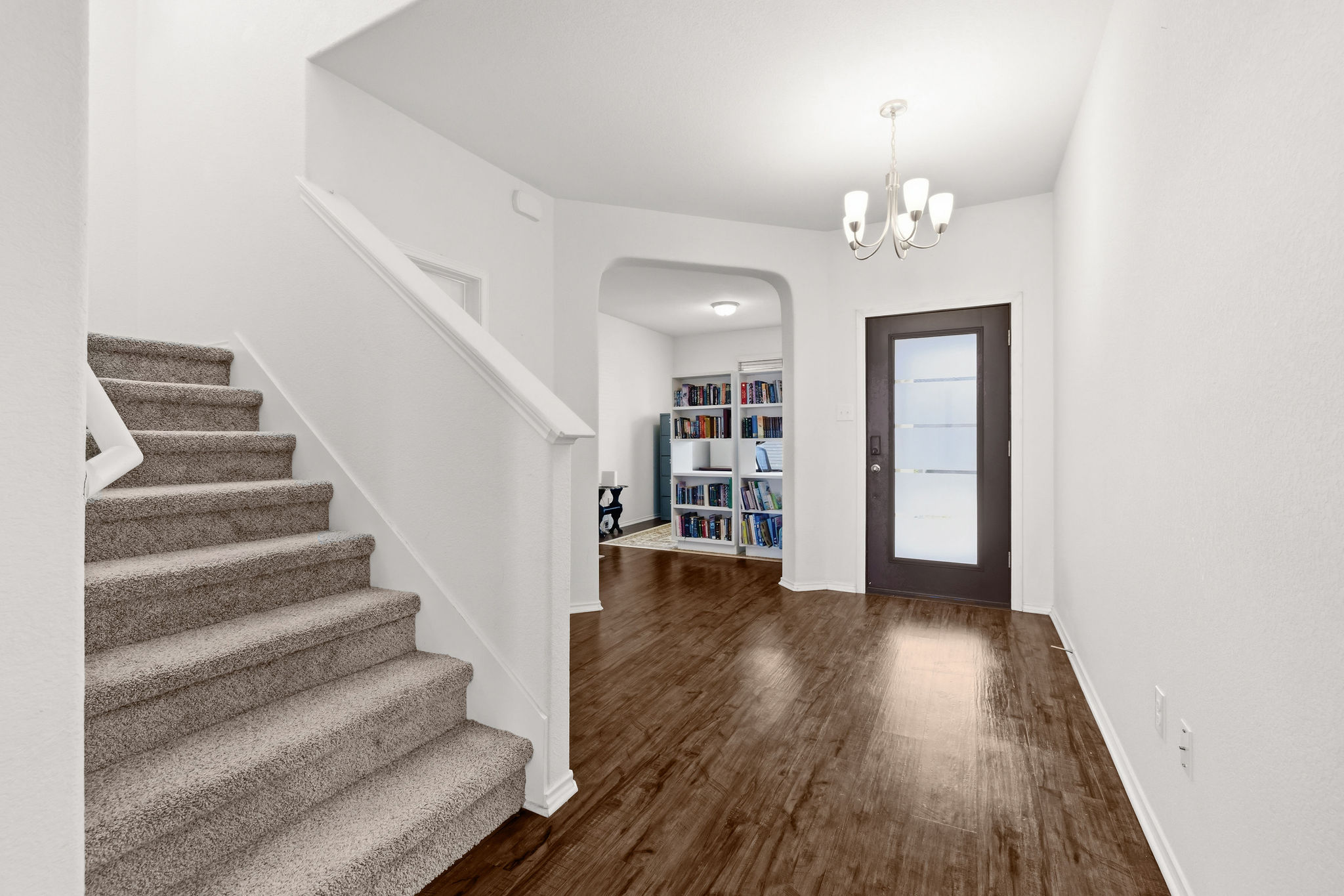 220 Saranac Drive Elgin, TX 78621 - Photo 5 of 32 a view of a room with wooden floor and stairs