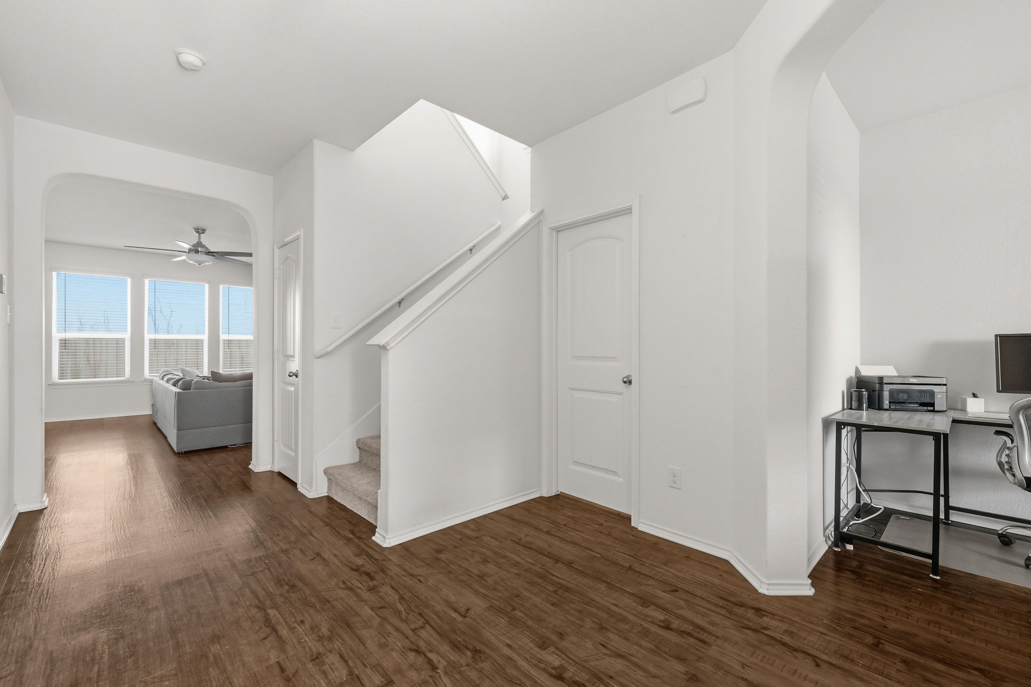 220 Saranac Drive Elgin, TX 78621 - Photo 6 of 32 a view of a livingroom with wooden floor and stairs