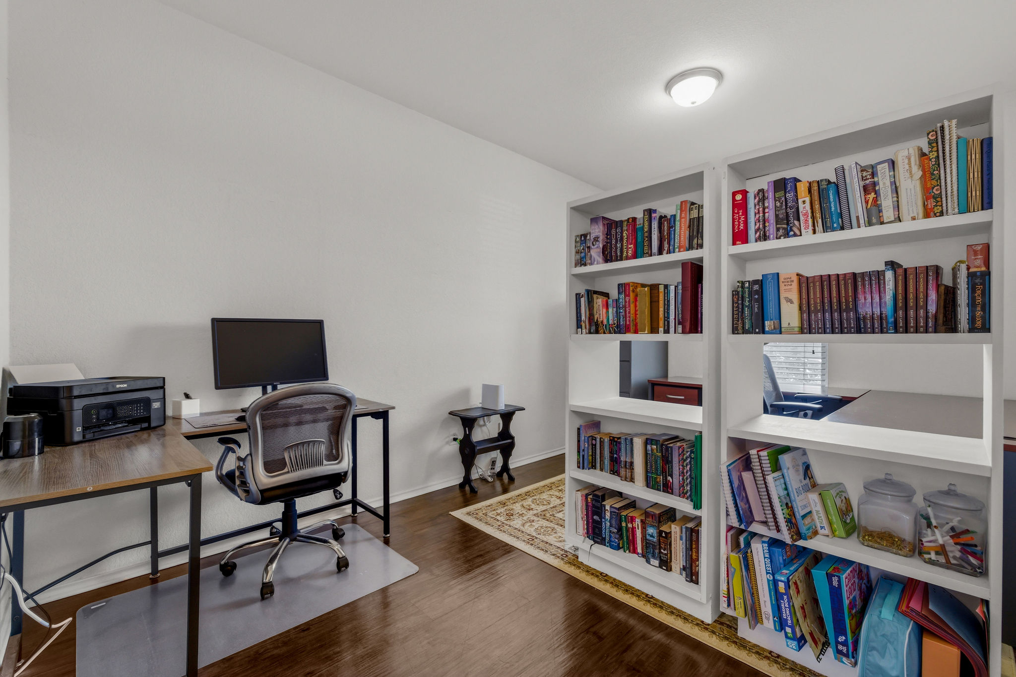 220 Saranac Drive Elgin, TX 78621 - Photo 7 of 32 a view of a workspace with bookshelf