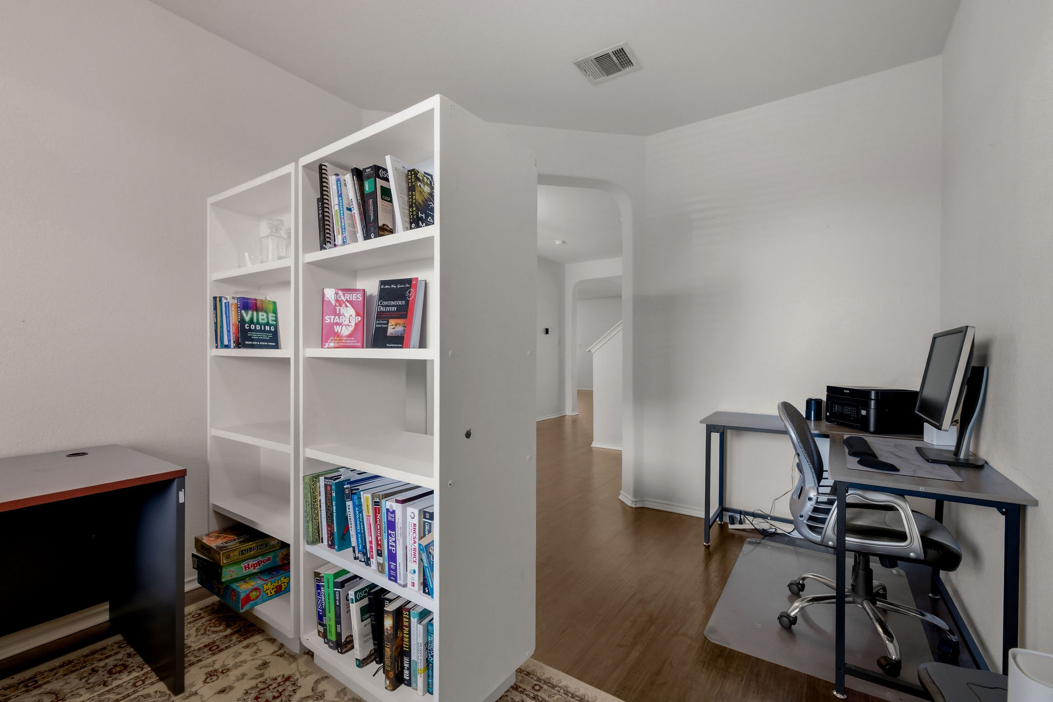 220 Saranac Drive Elgin, TX 78621 - Photo 8 of 32 a view of a workspace with furniture and wooden floor