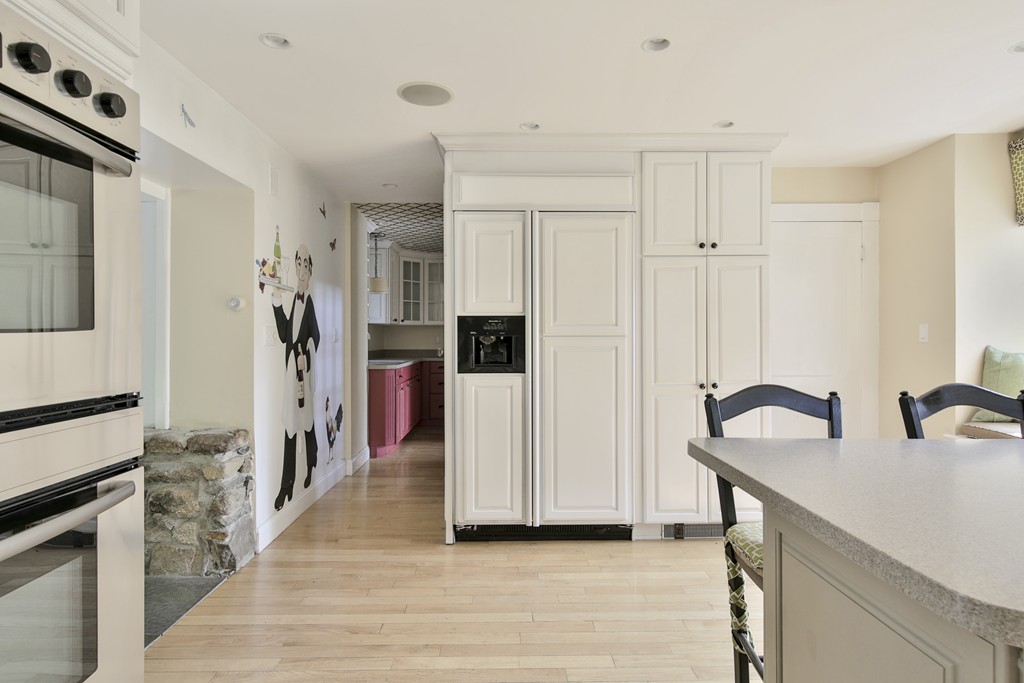 50 Dalton Road Chelmsford, MA 01824 - Photo 12 of 27 a kitchen with stainless steel appliances granite countertop a refrigerator and a stove top oven