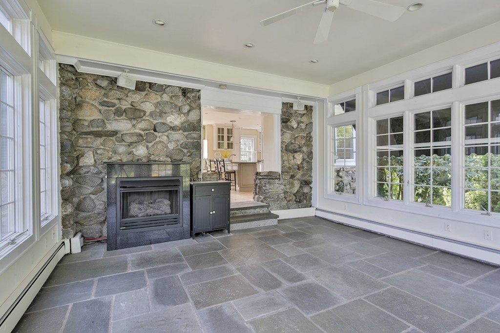 50 Dalton Road Chelmsford, MA 01824 - Photo 15 of 27 a living room with a fireplace and a floor to ceiling window