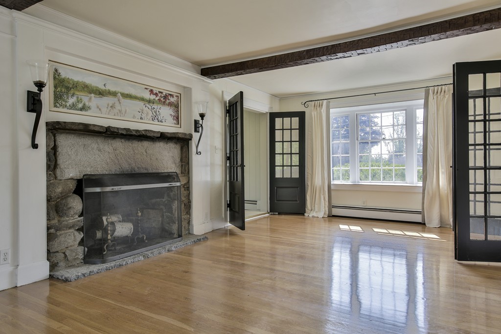 50 Dalton Road Chelmsford, MA 01824 - Photo 18 of 27 a view of an empty room with wooden floor and a window