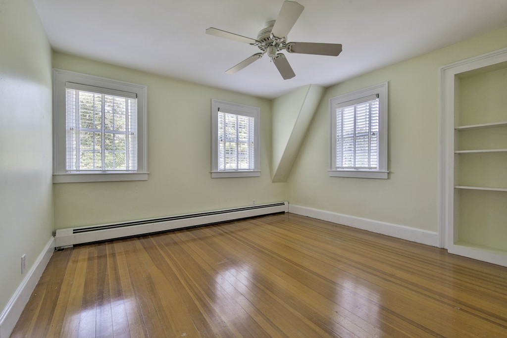 50 Dalton Road Chelmsford, MA 01824 - Photo 26 of 27 a view of an empty room with wooden floor and a window