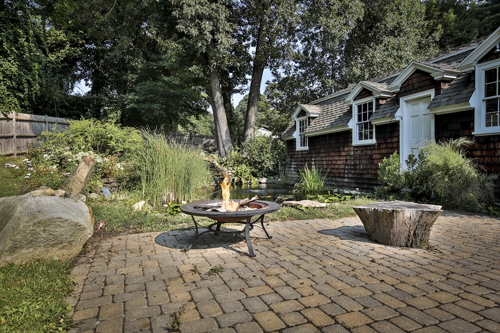 50 Dalton Road Chelmsford, MA 01824 - Photo 5 of 27 a view of backyard of house with outdoor seating