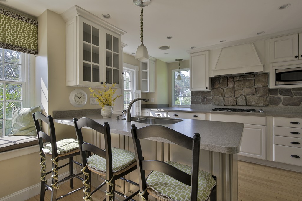 50 Dalton Road Chelmsford, MA 01824 - Photo 10 of 27 a kitchen with a dining table chairs cabinets and stainless steel appliances