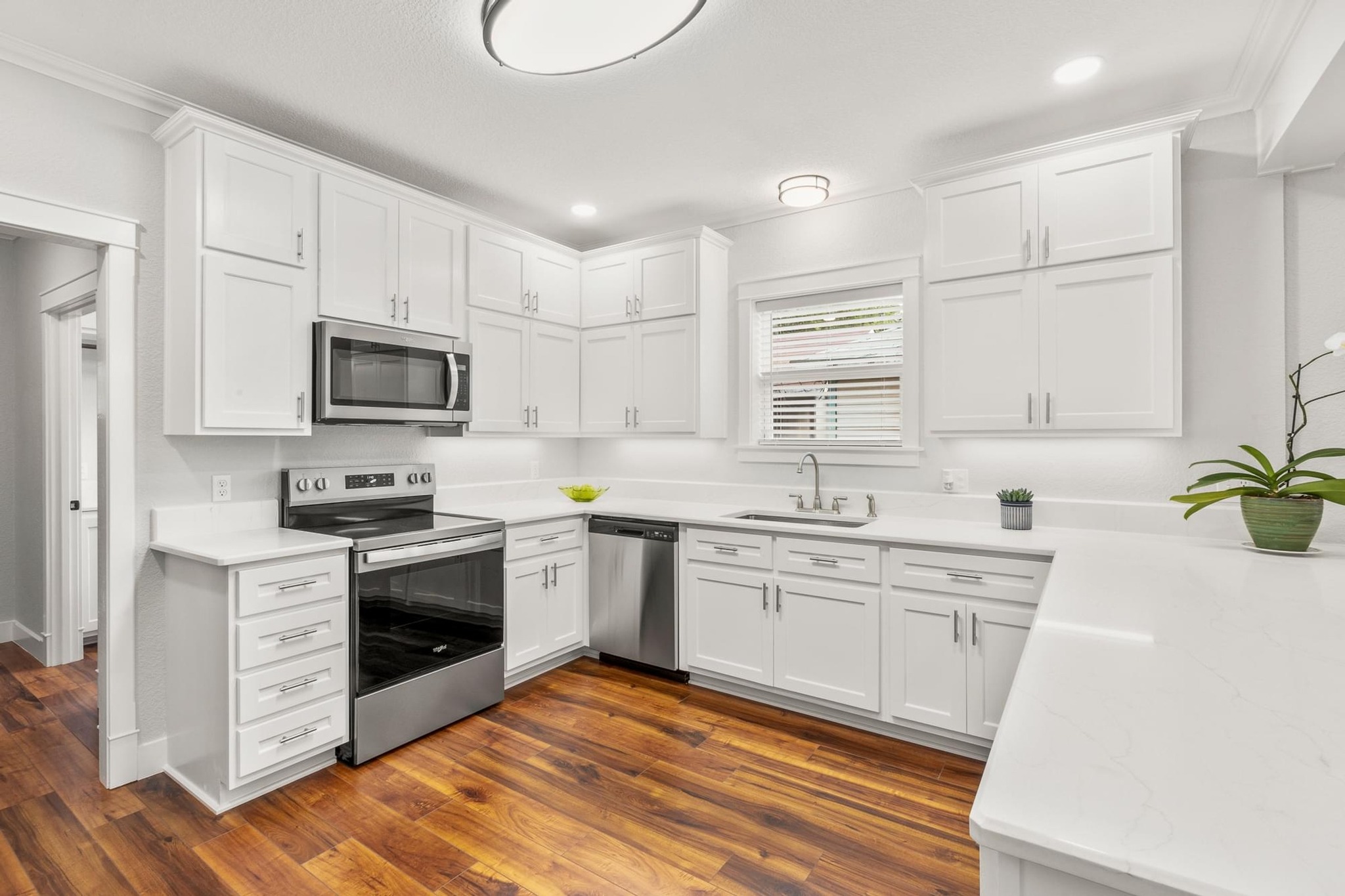 522 South Walnut Avenue Luling, TX 78648 - Photo 12 of 33 a kitchen with granite countertop a sink cabinets stainless steel appliances and a counter space