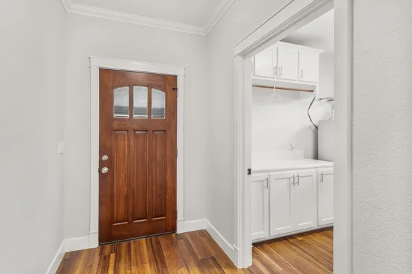 a view of walk in closet with empty racks