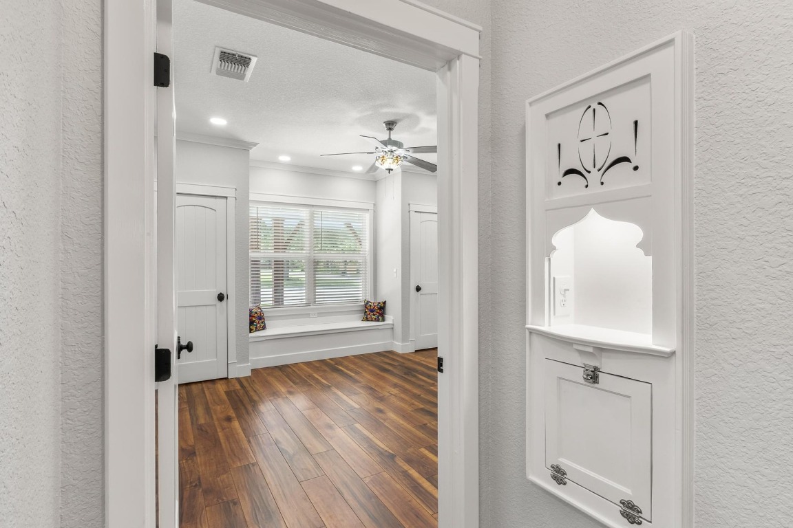 522 South Walnut Avenue Luling, TX 78648 - Photo 17 of 33 wooden floor with a chandelier