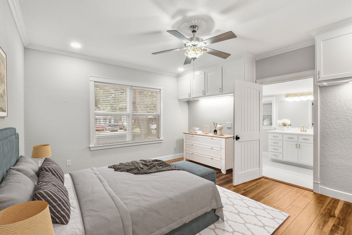 522 South Walnut Avenue Luling, TX 78648 - Photo 21 of 33 a bedroom with a bed and wooden floor