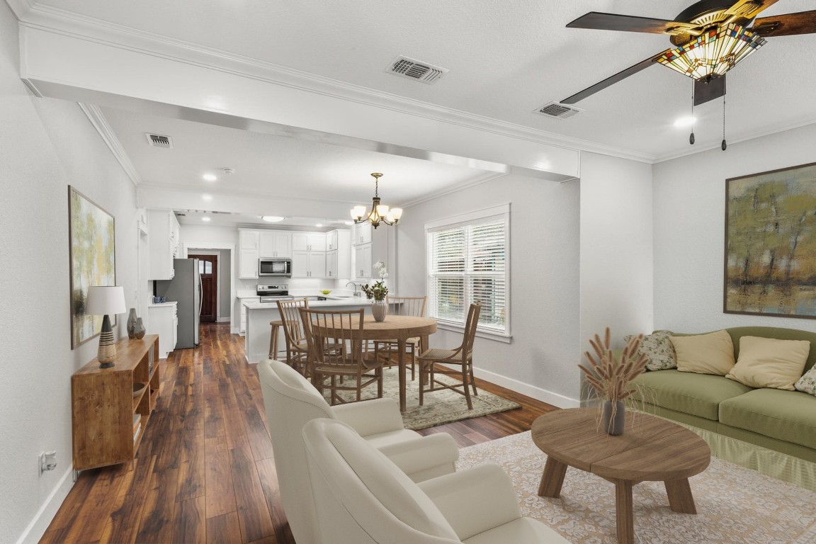 522 South Walnut Avenue Luling, TX 78648 - Photo 8 of 33 a living room with furniture and a dining table with wooden floor