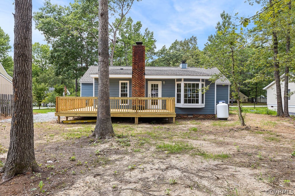 5019 Rollingway Road Chesterfield, VA 23832 - Photo 23 of 24 a view of a house with a yard and trees