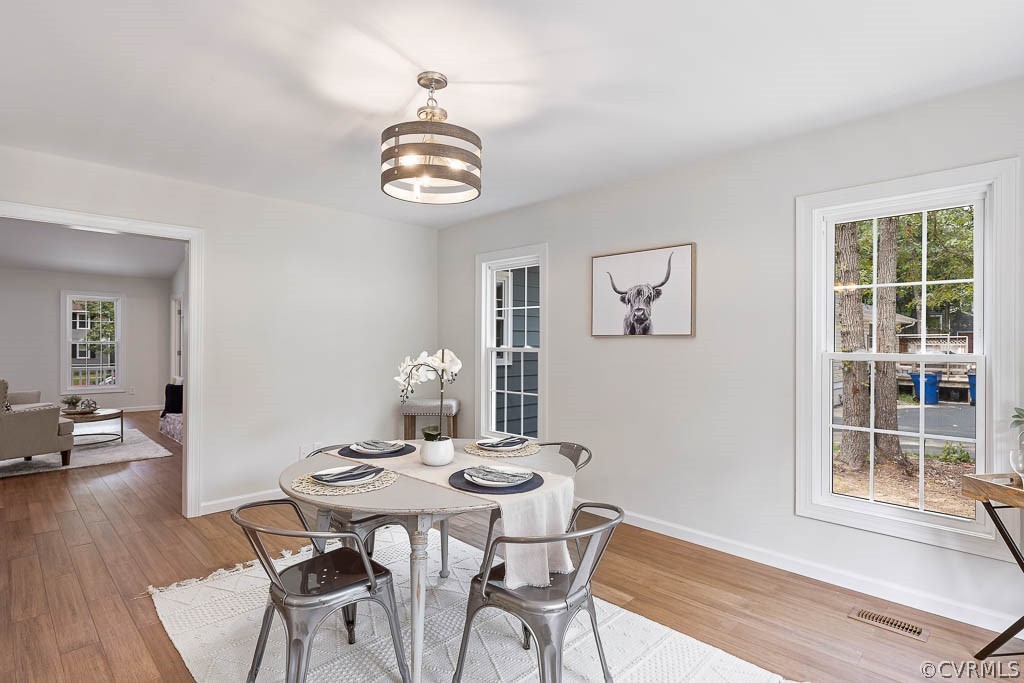 5019 Rollingway Road Chesterfield, VA 23832 - Photo 10 of 24 a view of a dining room with furniture wooden floor and a rug