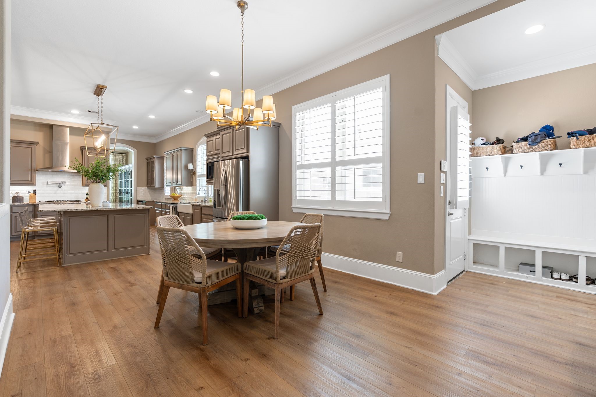 2914 Rutherford Pl Court Katy, TX 77494 - Photo 17 of 50 a dining room with wooden floor a chandelier a wooden table and chairs