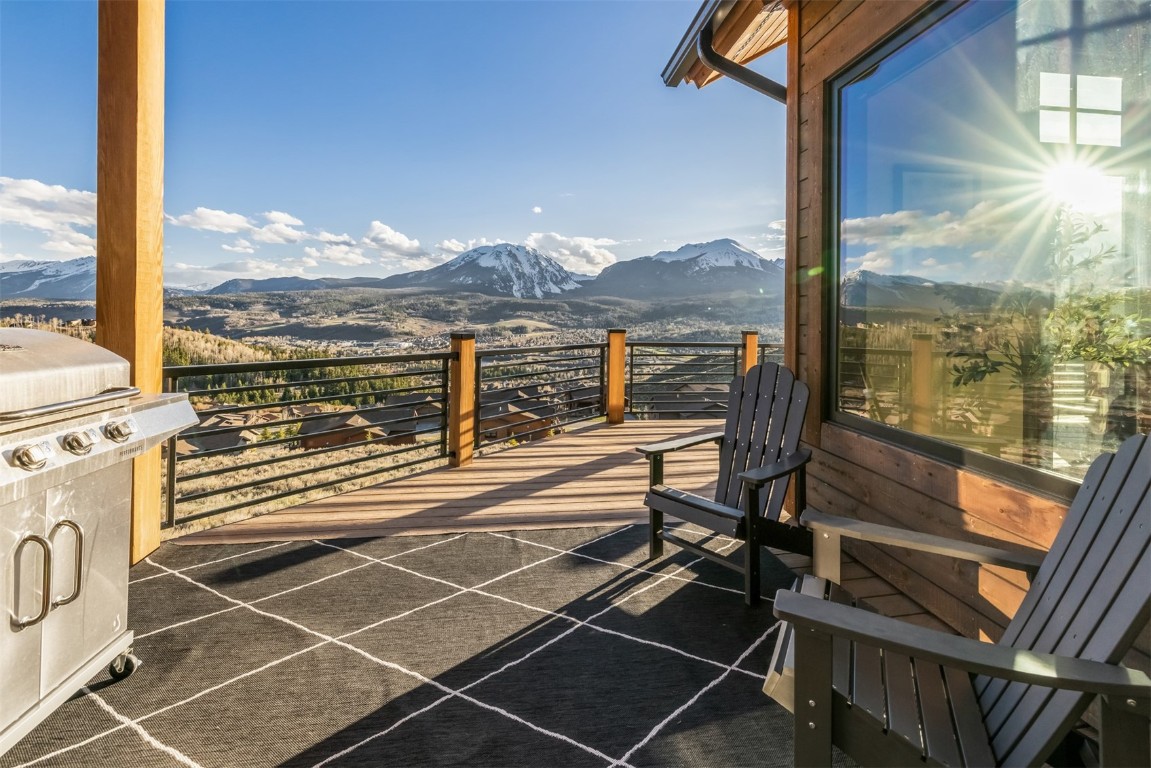 391 Angler Mountain Ranch Road Silverthorne, CO 80498 - Photo 12 of 50 a view of a balcony with floor to ceiling windows with wooden floor