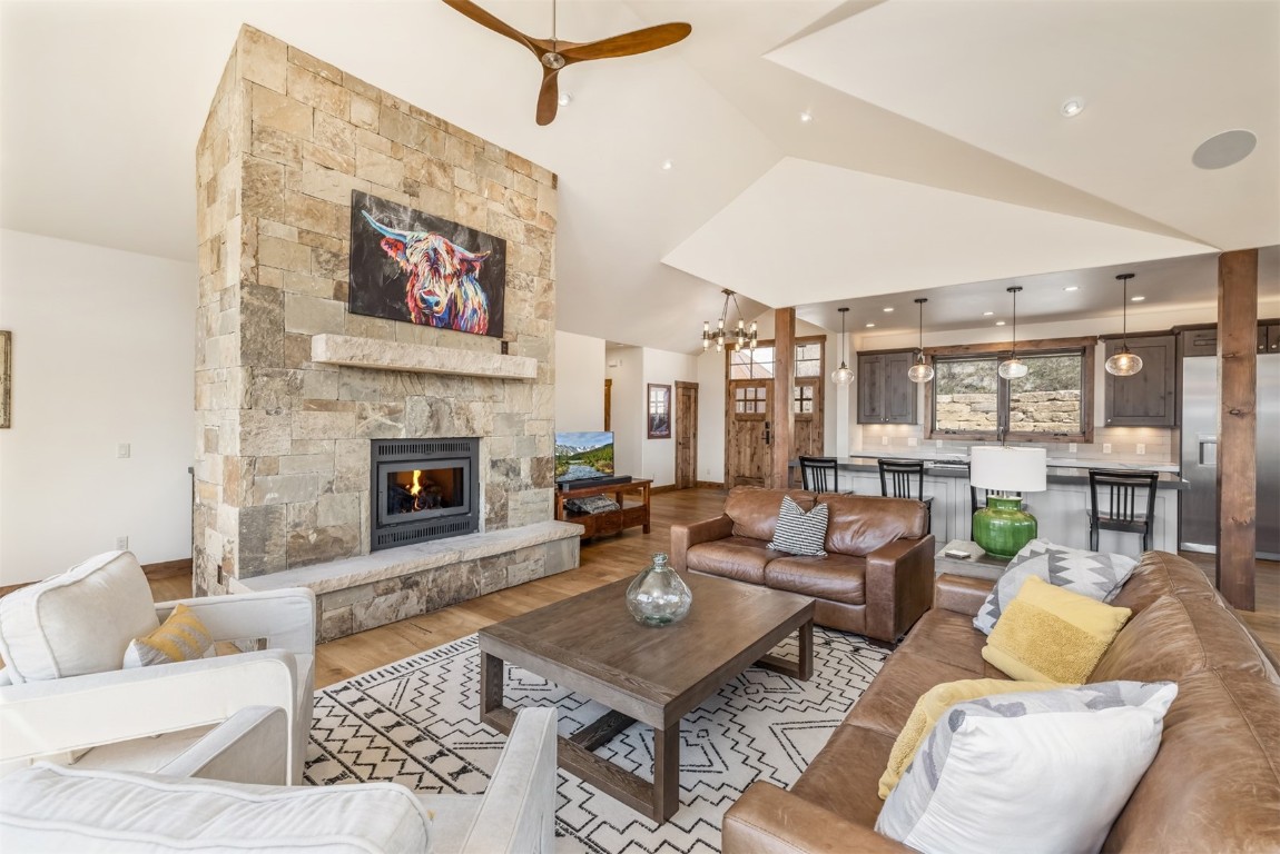 391 Angler Mountain Ranch Road Silverthorne, CO 80498 - Photo 17 of 50 a living room with furniture and a fireplace