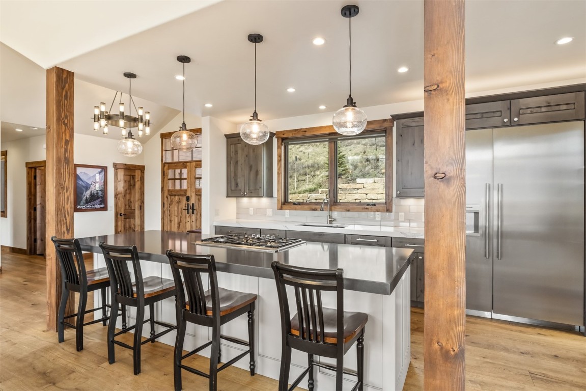 391 Angler Mountain Ranch Road Silverthorne, CO 80498 - Photo 18 of 50 a large kitchen with a table and chairs