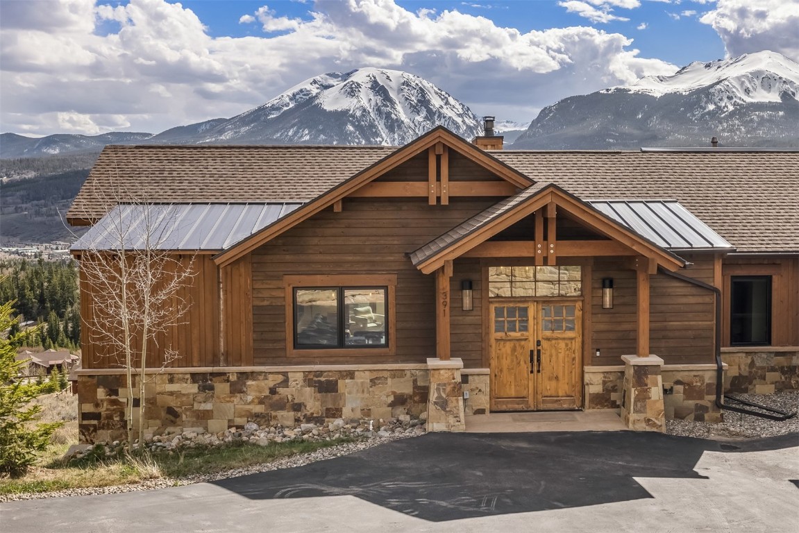 391 Angler Mountain Ranch Road Silverthorne, CO 80498 - Photo 2 of 50 a front view of a house with a yard