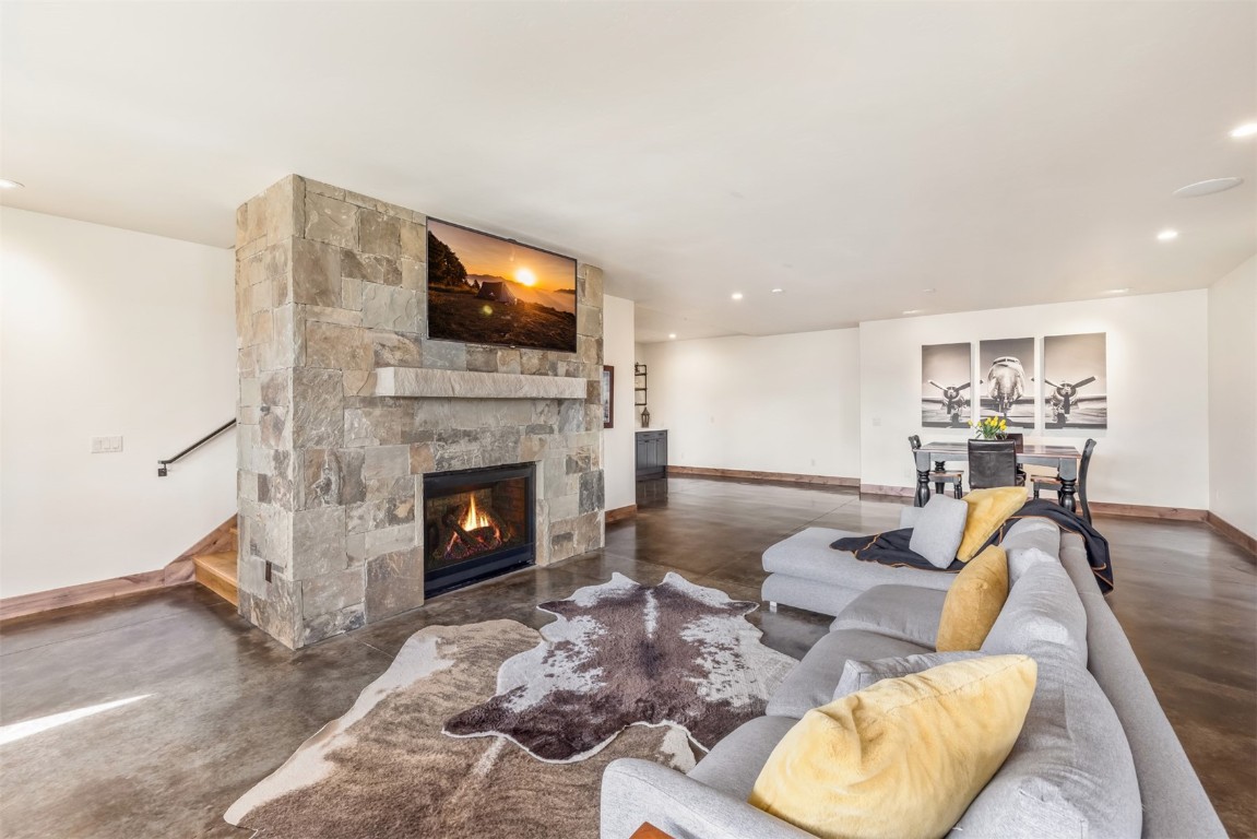 391 Angler Mountain Ranch Road Silverthorne, CO 80498 - Photo 33 of 50 a living room with furniture and a fireplace