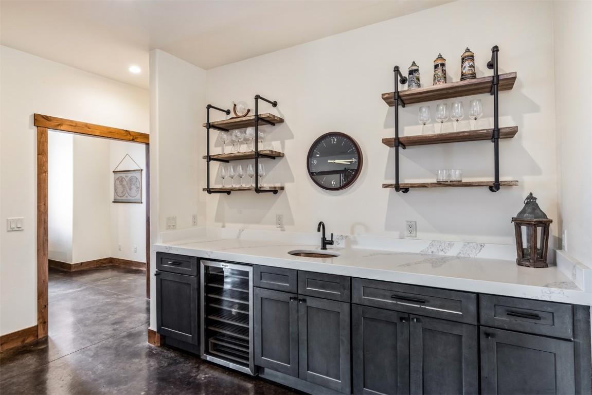 391 Angler Mountain Ranch Road Silverthorne, CO 80498 - Photo 35 of 50 a kitchen with a sink and a clock on the wall