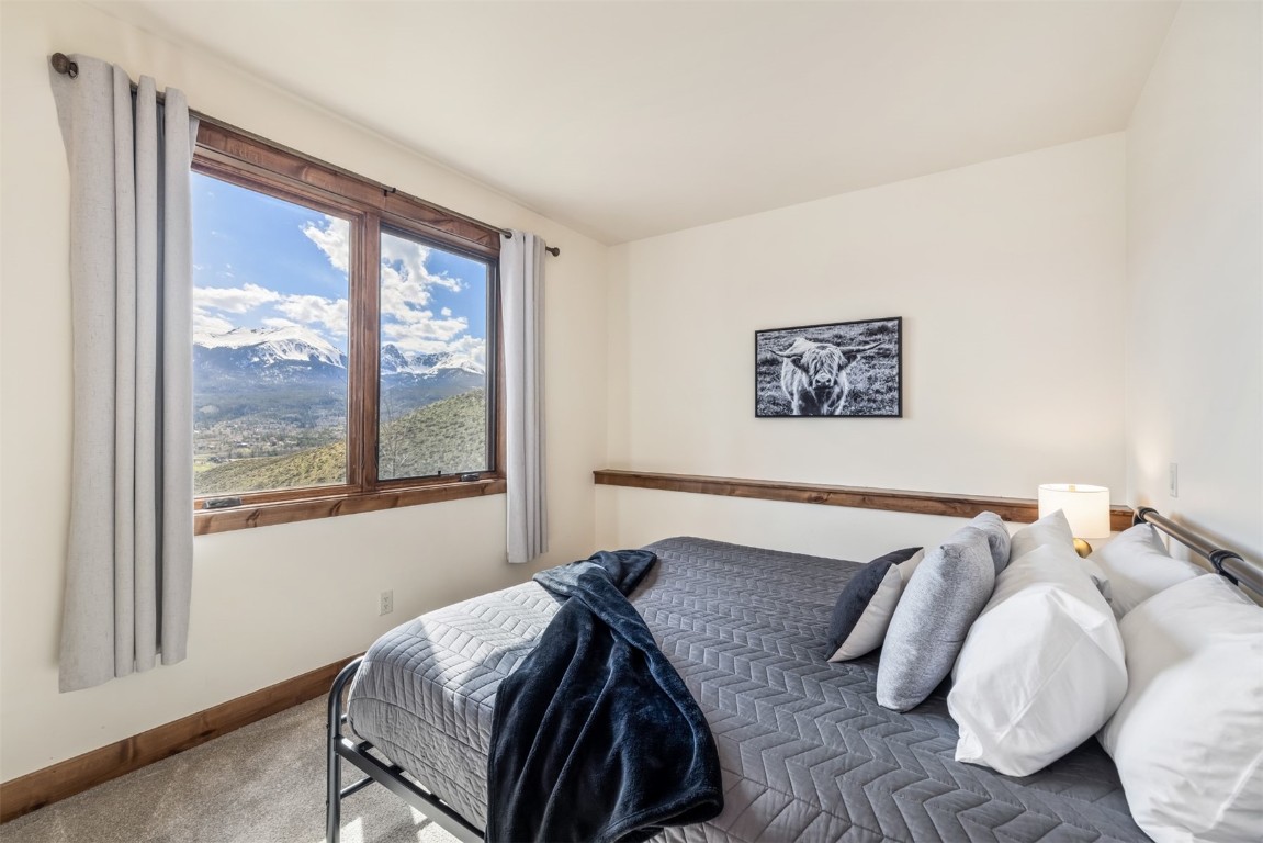 391 Angler Mountain Ranch Road Silverthorne, CO 80498 - Photo 39 of 50 a bedroom with a bed and a window