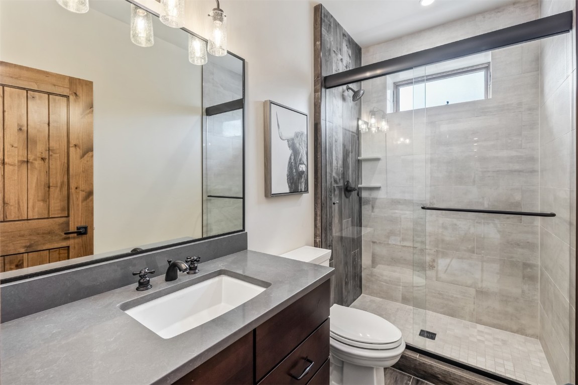 391 Angler Mountain Ranch Road Silverthorne, CO 80498 - Photo 40 of 50 a bathroom with a sink a toilet and shower