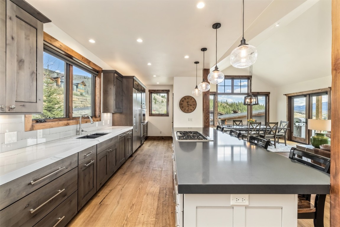 391 Angler Mountain Ranch Road Silverthorne, CO 80498 - Photo 7 of 50 a large kitchen with a table and chairs