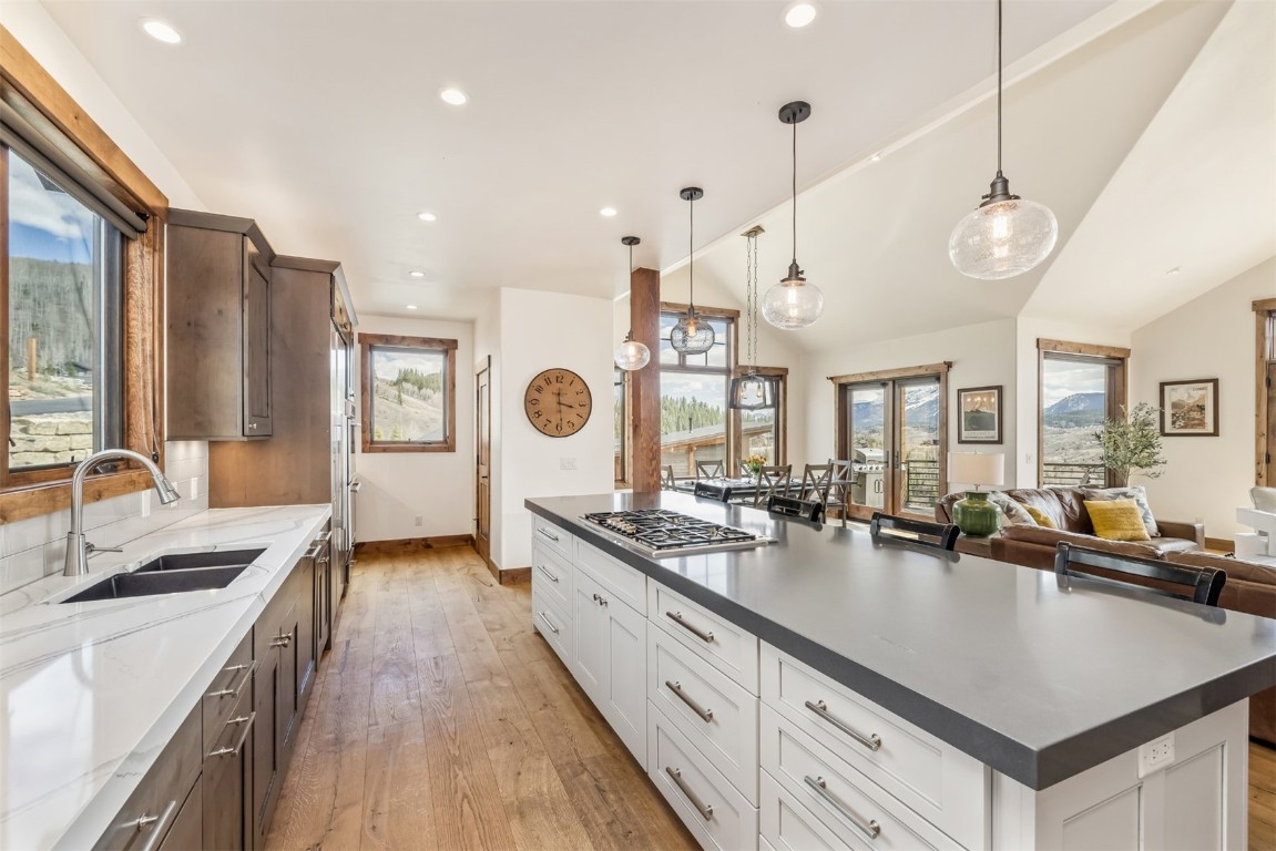 391 Angler Mountain Ranch Road Silverthorne, CO 80498 - Photo 8 of 50 a large kitchen with stainless steel appliances granite countertop a lot of counter space and a sink