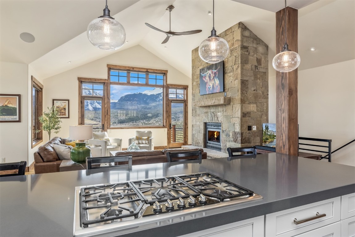391 Angler Mountain Ranch Road Silverthorne, CO 80498 - Photo 9 of 50 a large kitchen with a table and stainless steel appliances