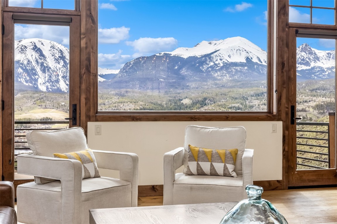 391 Angler Mountain Ranch Road Silverthorne, CO 80498 - Photo 10 of 50 a view of a balcony with furniture and floor to ceiling window