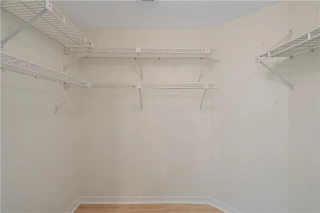 a view of washer and dryer with wooden floor